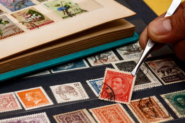 stamp collecting tongs and stamps